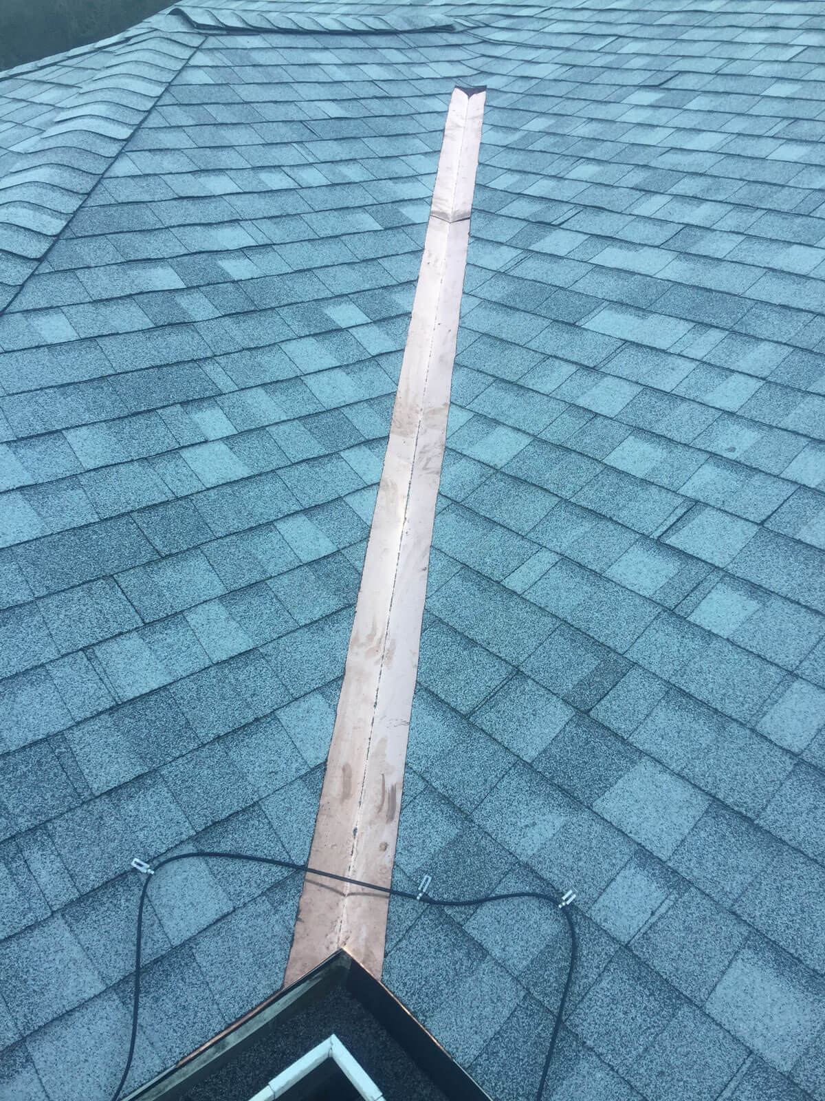 New shingle roof with copper valley flashing
