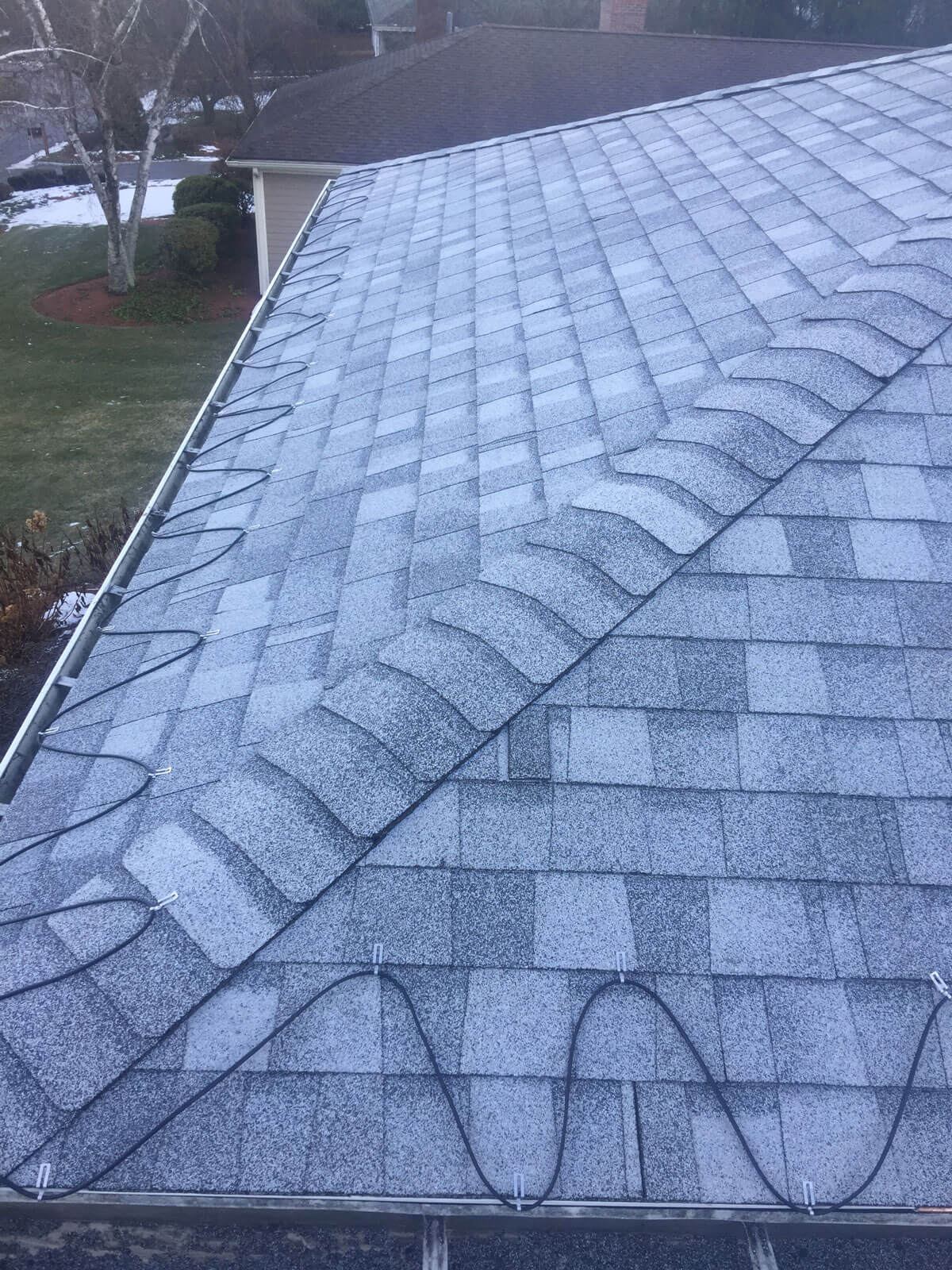 New shingle roof with ice-melt cable system