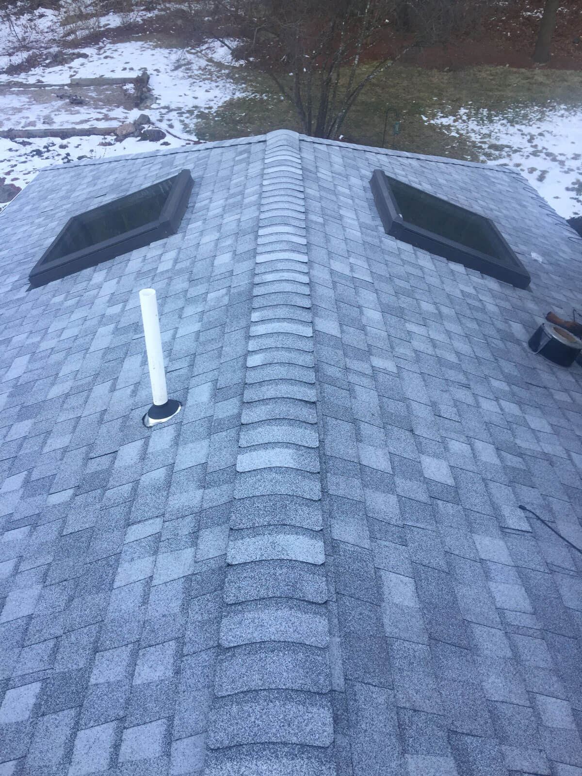 New shingle roof with skylights and ridge cap