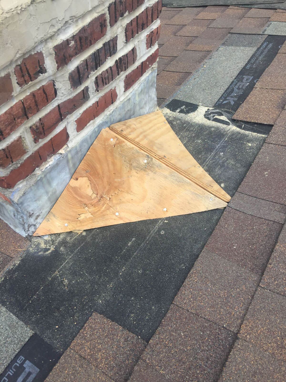 Chimney base prep before flashing