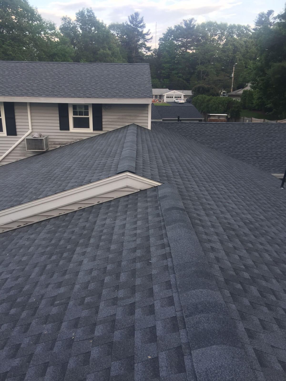 Dark architectural shingles on a multi-gable roof