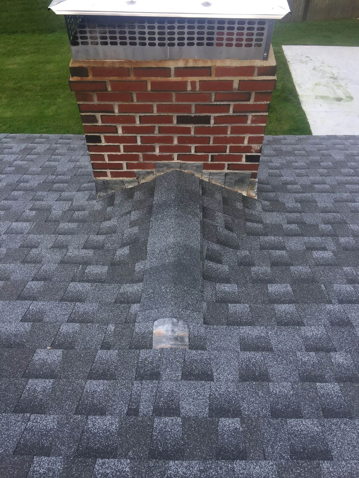 New shingle roof with chimney saddle / cricket